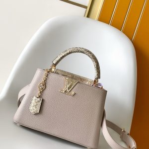 p130021 x 13.6 x 8 (cm) (Length x Height x Width) 27 x 17.3 x 9 (cm) (Length x Height x Width) • Taurillon calf leather • Taurillon calf leather trim • Calf leather lining • Metal hardware • Flap can be positioned inside or outside • Compartment features zippered pocket and slip pocket • Metal studs • Holds smartphone, LV Vertical wallet, headphones,keys, and lipstick • Shoulder strap: detachable, adjustable • Half strap length: 46.5 cm • Adjustable half strap length: 55.0 cm • Handle: single handle